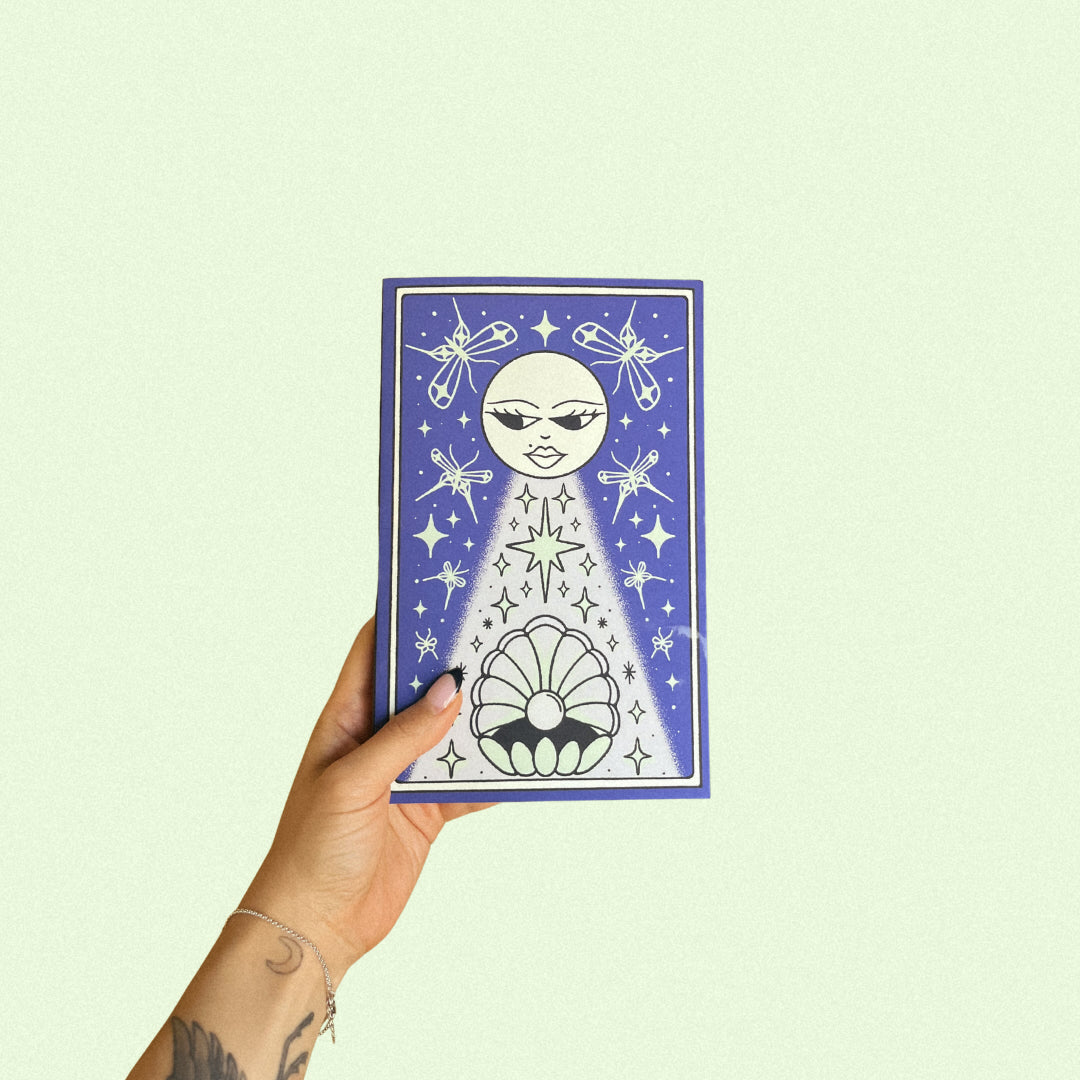 Hand illustrated journal cover depicting moths, stars and an oyster under the moonlight. 